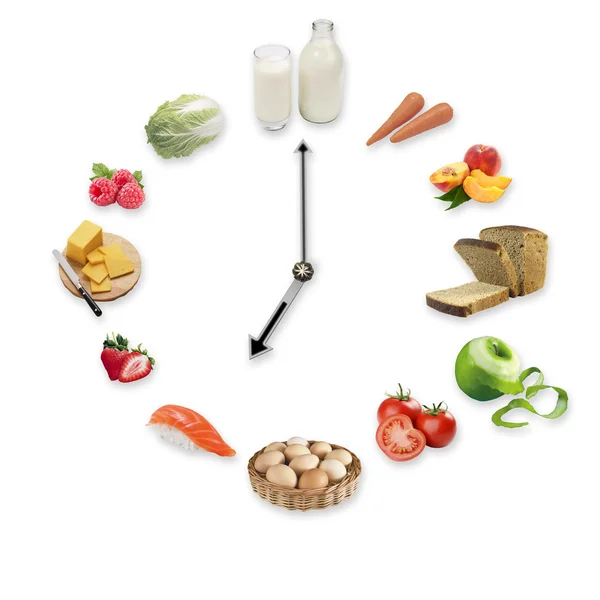 Beyaz arka plan üzerinde izole sağlıklı gıda ürünleri düzenlenmiş saat. Sağlıklı gıda kavramı.