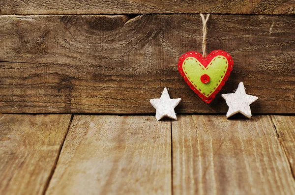 Handmade from felt heart, white stars on wooden background with  copy space. — Stock Photo, Image