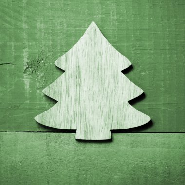 Yeşil ahşap arka plan basit yeşil Noel ağacına.