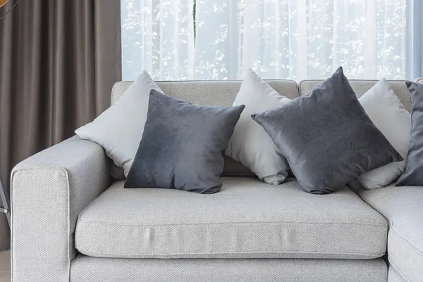 Modern white sofa with black and white pillows — Stock Photo, Image