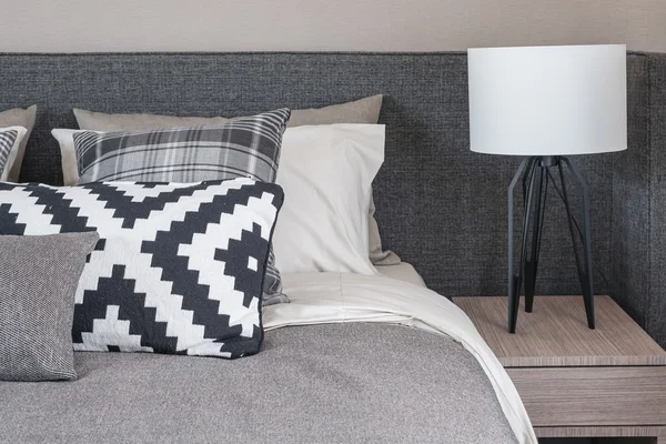 Black and white pillows on modern bed — Stock Photo, Image