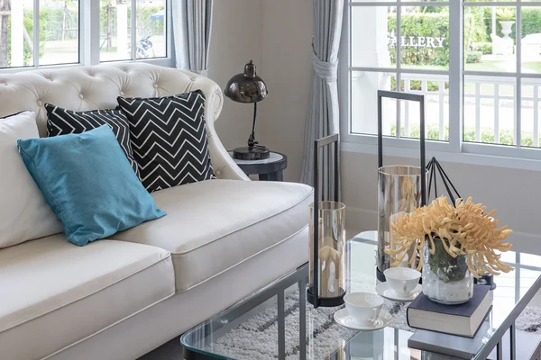 white sofa and vase of plant on table in luxury living room