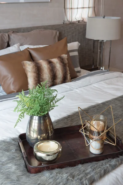 wooden tray of plant in modern bedroom with white lamp on wooden