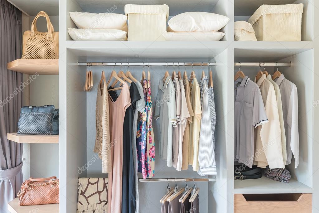 Colorful Wooden Cloth Hangers On Clothes Rail In White Wardrobe Stock  Photo, Picture and Royalty Free Image. Image 43816766.