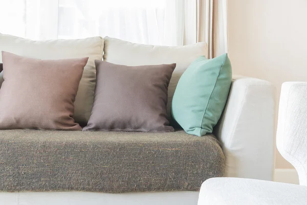 Modern sofa and set of pillows in modern bedroom — Stock Photo, Image