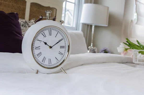 Classic white alarm clock style in classic bedroom — Stock Photo, Image