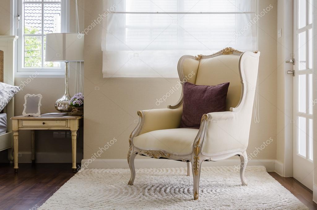 classic chair style on carpet in bedroom