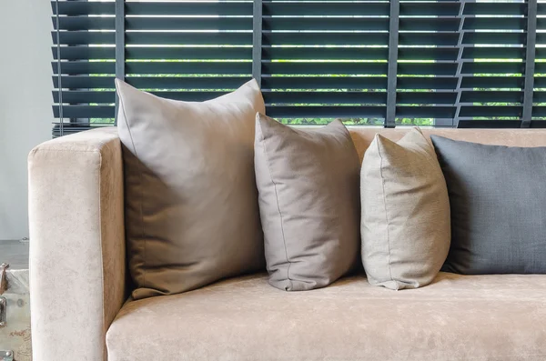 Row of pillows on modern sofa — Stock Photo, Image