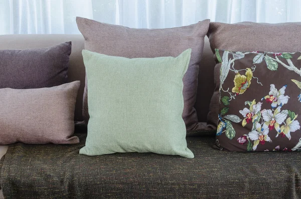 Green pillow with blanket on sofa in living room — Stock Photo, Image