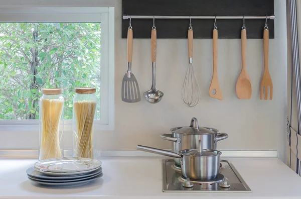 Stainless pan on gas stove with hood — Stock Photo, Image