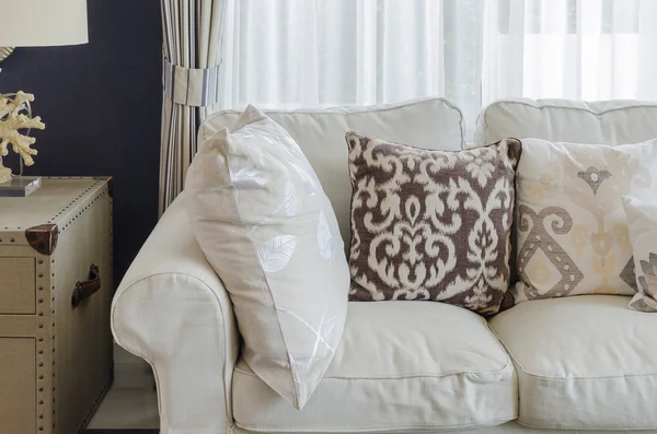 beige color sofa and pillows in living room