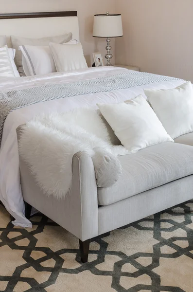 Luxury grey sofa on carpet in luxury bedroom — Stock Photo, Image
