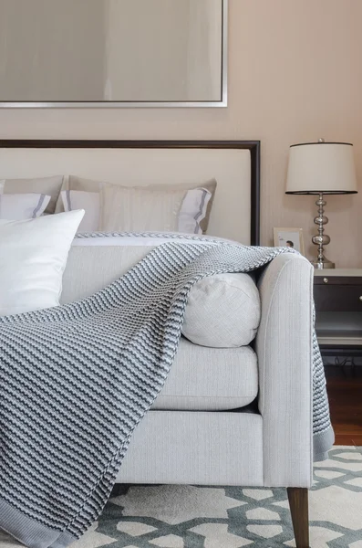 Luxury grey sofa on carpet in luxury bedroom — Stock Photo, Image