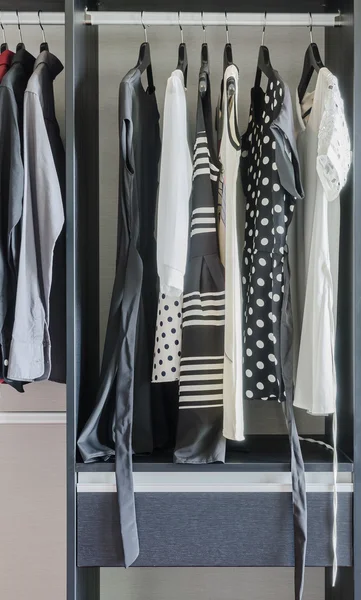 Row of black and white dress in wardrobe — Stock Photo, Image