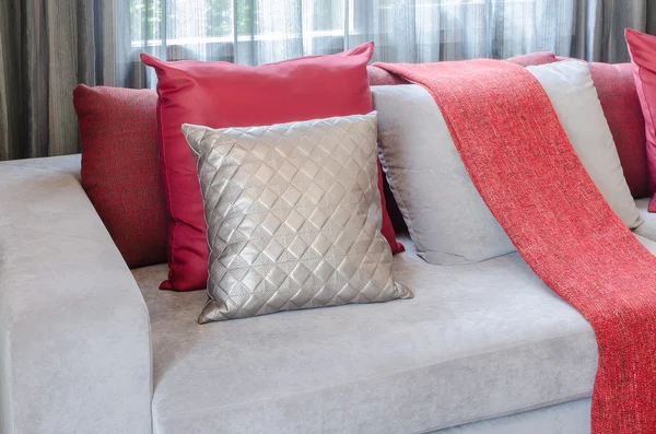 Luxury sofa with pillows and red blanket in living room — Stock Photo, Image