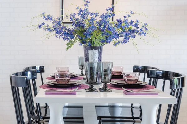 Dinning table set with black chair and flower — Stock Photo, Image