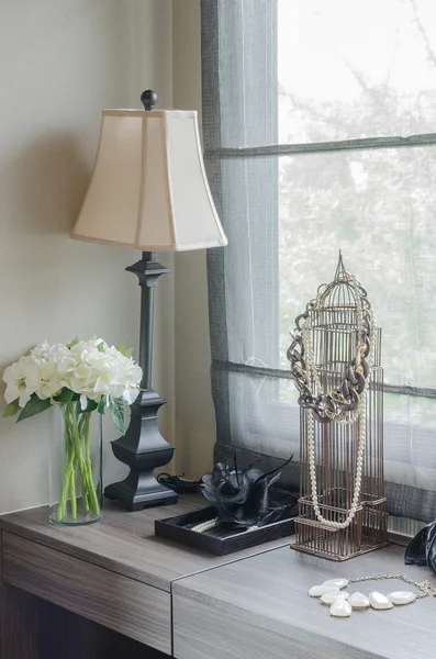 Lamp with vase of plant on dressing table — Stock Photo, Image