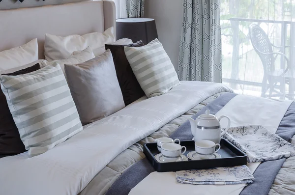 Tea cup set on black tray in bedroom — Stock Photo, Image