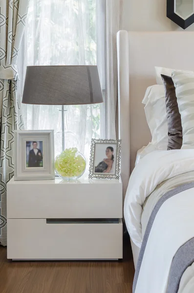 Bedroom with lamp on white table — Stock Photo, Image