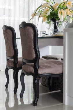 pillows on blue sofa with lamp