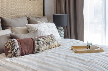 pillows on blue sofa with lamp