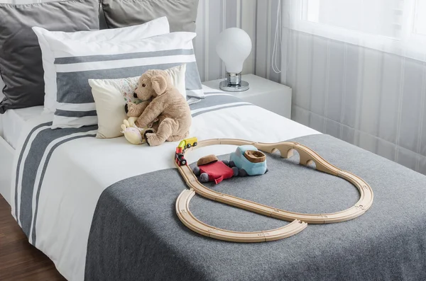 Kid's bedroom with dolls on bed in black and white style — Φωτογραφία Αρχείου