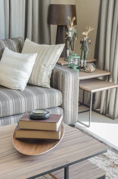 Pillows on blue sofa with lamp — Stockfoto