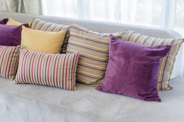 group of colorful pillows on sofa in living room 