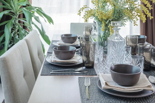 Table set on wooden table in dinning room — Stock Photo, Image