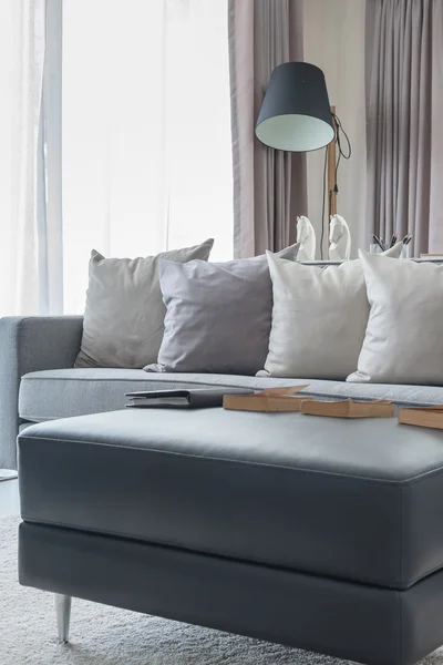 Row of pillows on modern grey sofa — Stock Photo, Image