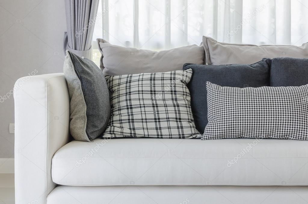 modern white sofa in modern living room with pillows 