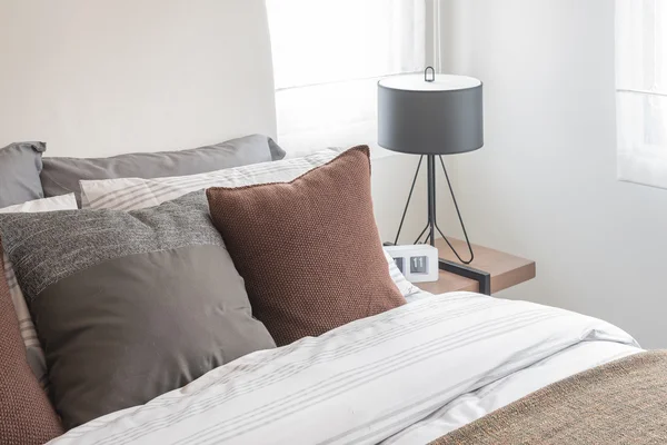 Modern black lamp on table in modern bedroom — Stock Photo, Image