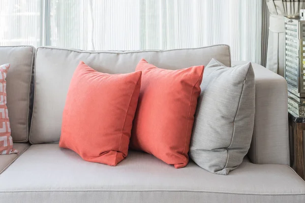 Row of pillows on sofa in classic living room style — Stock Photo, Image