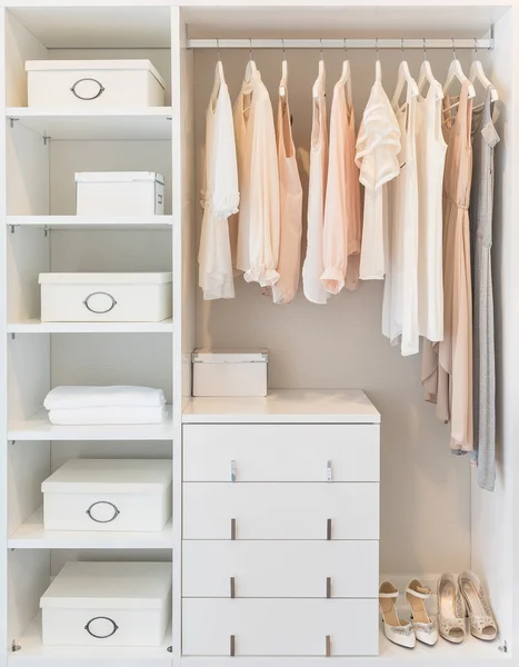 White wardrobe on wooden floor with dress — Stock Photo, Image