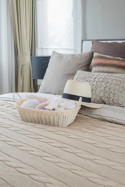 Basket of crochet with hat on bed in classic bedroom — Stock Photo, Image