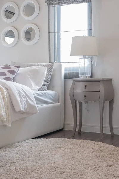 Modern white bedroom with white bed and white lamp — Stock Photo, Image