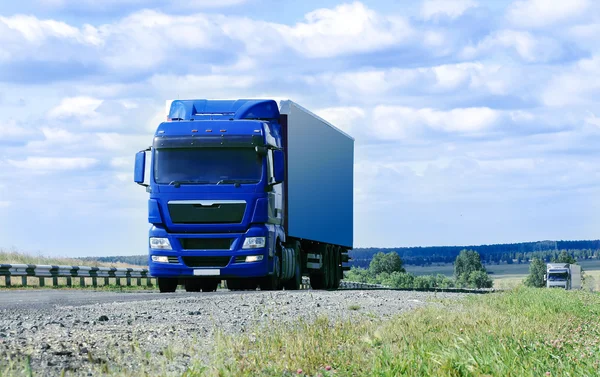 Two big trucks move on highway Stockbild