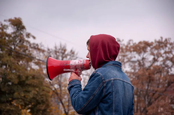 Krasnodar, Russia - November 17, 2020: Man speak through the speaking-trumpet. — 图库照片