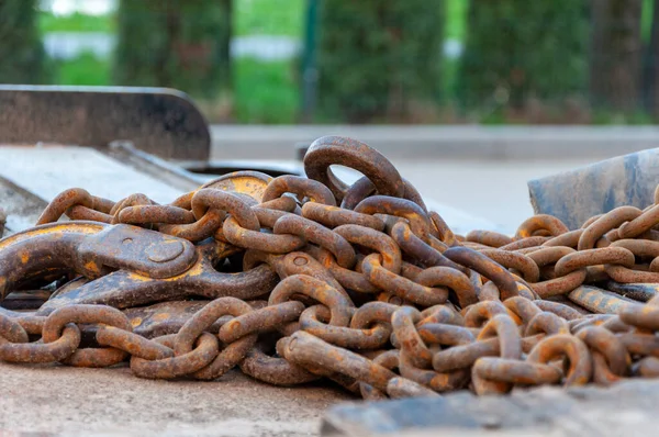 Old Rusty Chain. Rusty chains on blurred background. weathered chain links.