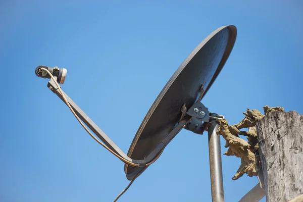 Black satellite antenna dish on the roof — Stock Photo, Image