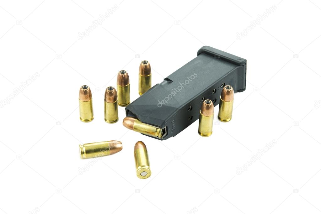 9mm bullets and magazine isolated on white background.