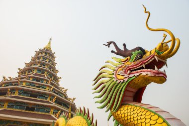 Dragon statue and pagoda at Hyuaplakang temple ,Thailand clipart