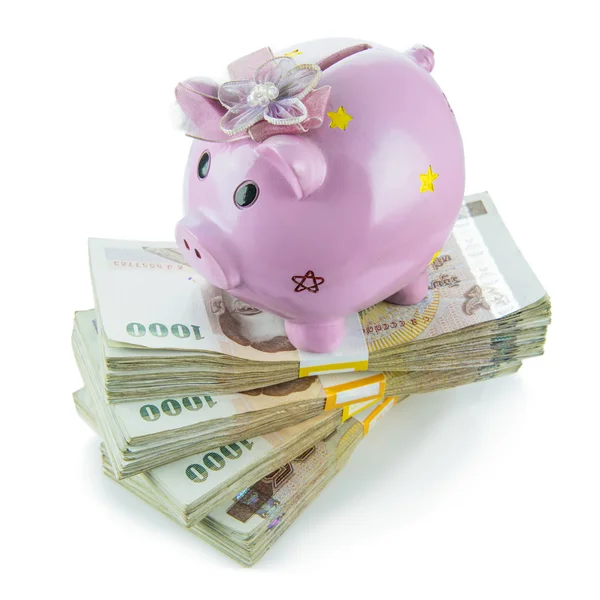 Piggy bank on money isolated on white background. — Stock Photo, Image
