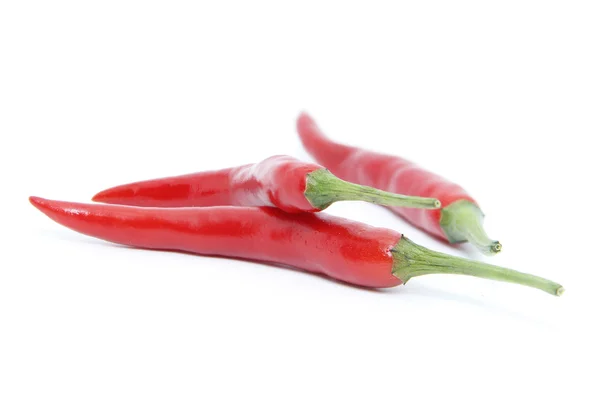 Свіжі три червоні кайенські перці — стокове фото