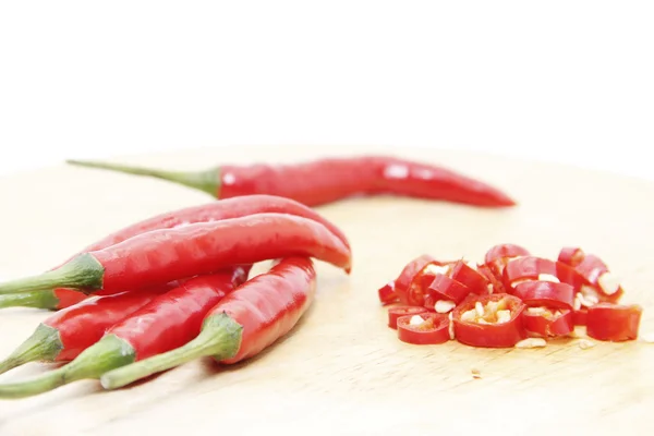 Red cayenne peppers sliced on board — Stock Photo, Image