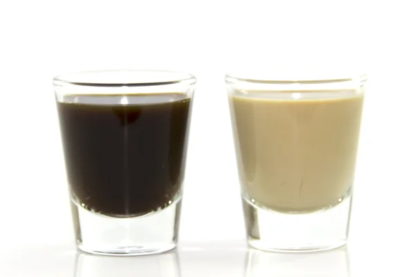 Café expreso y leche en vaso de chupito — Foto de Stock