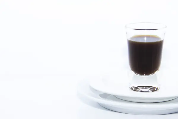 Espresso shot on double white plate — Stock Photo, Image