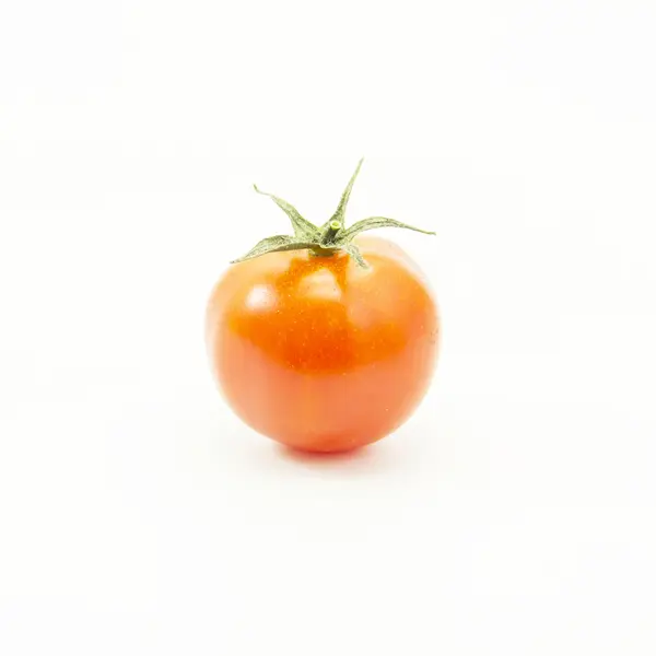 Orange tomat med grönt blad — Stockfoto