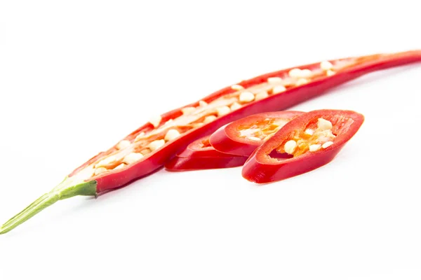 Sliced half and pieced of red chili pepper — Stock Photo, Image