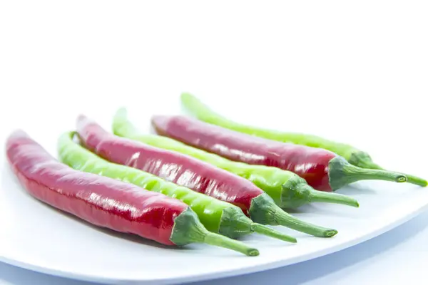 Contrast green switched red chili pepper — Stock Photo, Image